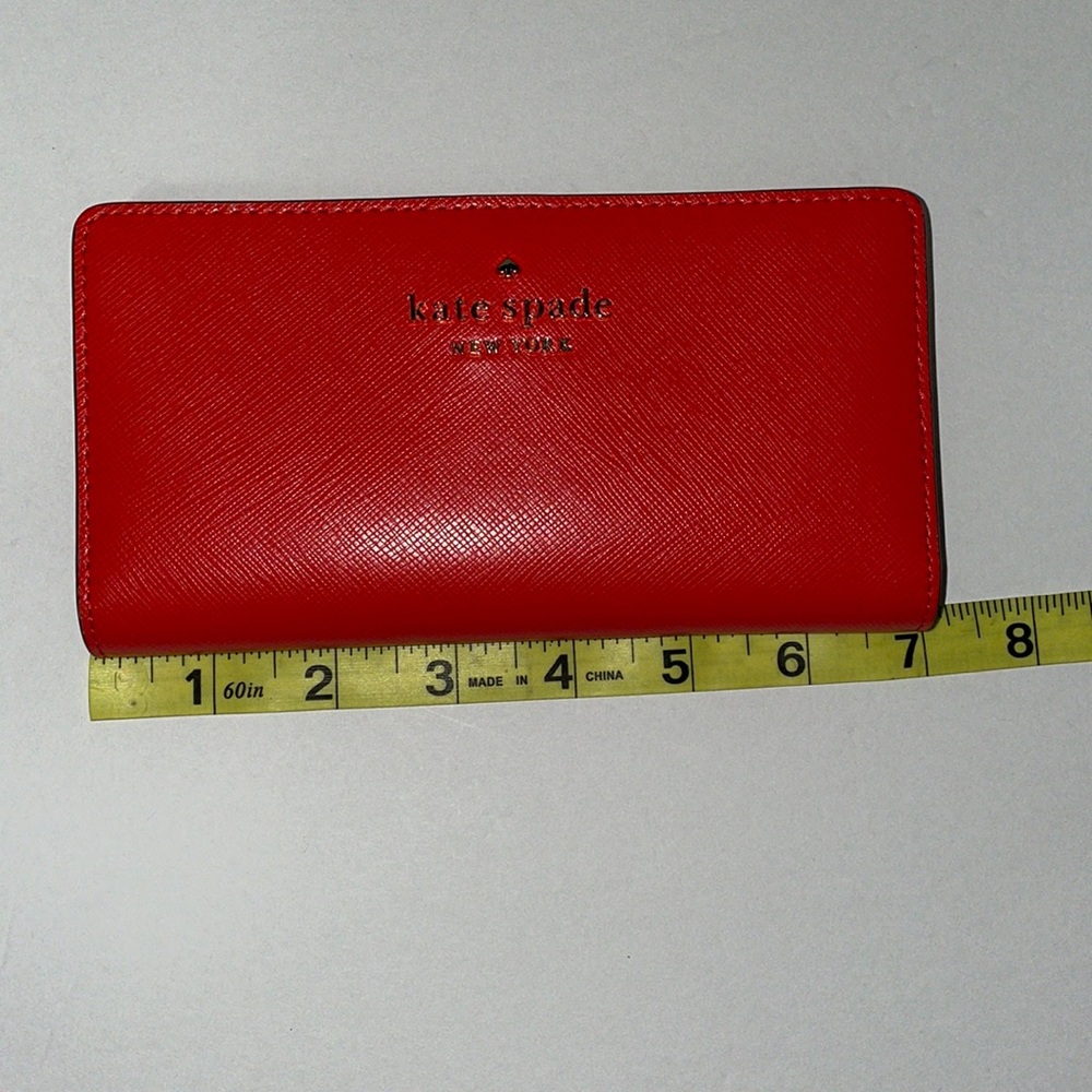 EUC Kate Spade wallet burnt orange in color